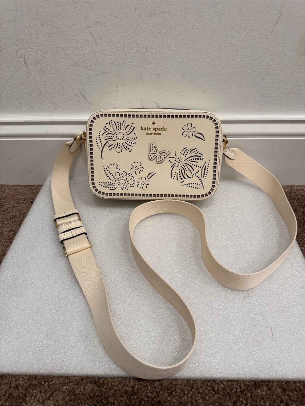 Kate Spade Madison Perforated Floral Butterfly Camera Crossbody Bag in Meringue